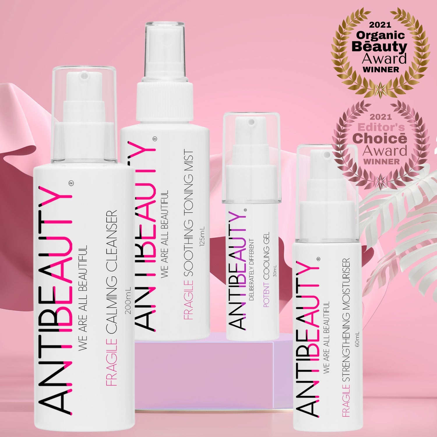 Fragile Calming Bundle for Sensitive Skin in front of a pink background on top of a podium
