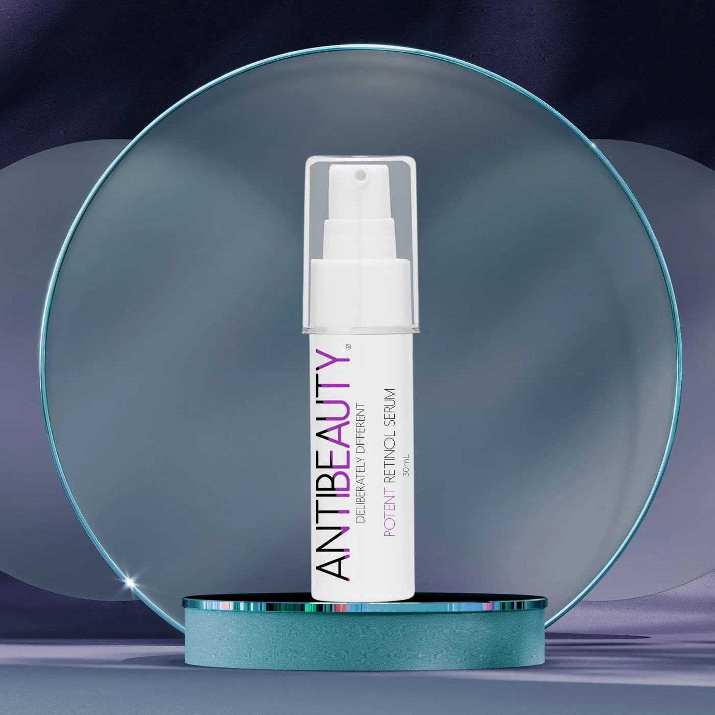 AntiBeauty Potent Retinol Serum - a powerful regenerating serum for all skin - on a blue platform with frosted blue ring background.