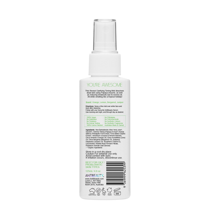 Back label of AntiBeauty Reveal Toning Mist bottle on white background, featuring product details and ingredients list.