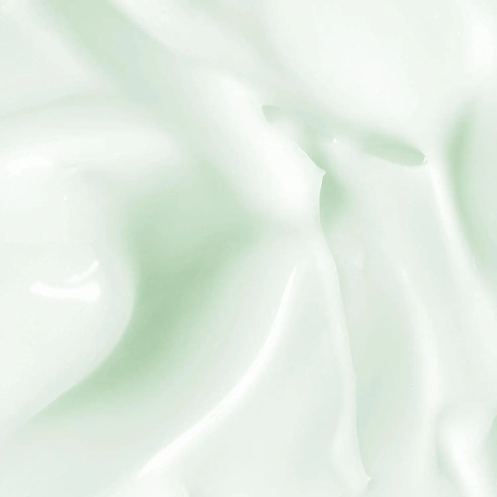 A swatch of the AntiBeauty Reveal Regulating Moisturiser, showing its light milky texture and hydrating properties for oily and acne prone skin.
