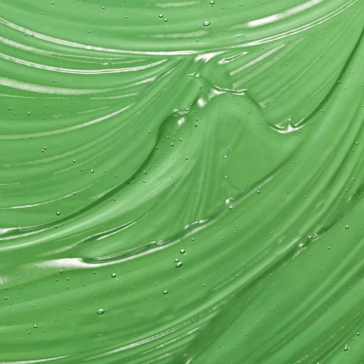 A swatch of the AntiBeauty Reveal Purifying Cleanser, showing its clear gel texture and soothing properties for oily and acne prone skin.