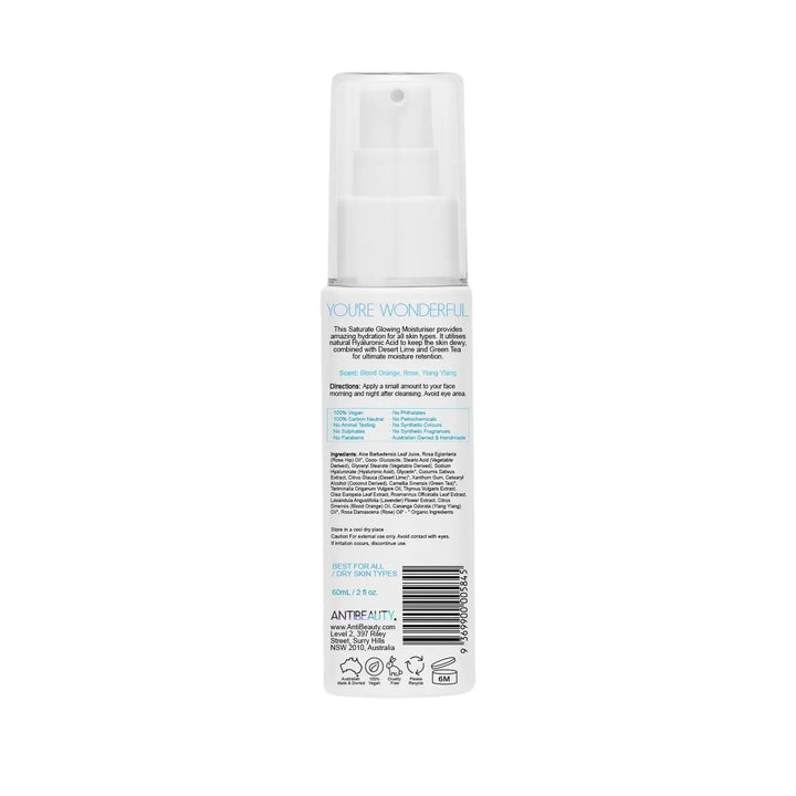 Back label of AntiBeauty Saturate Glowing Moisturiser bottle on white background, featuring product details and ingredients list.